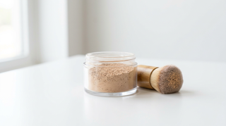 Loose mineral powder in a glass jar for oily and acne-prone skin