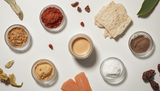 Mineral foundation ingredients in small glass dishes on a white surface